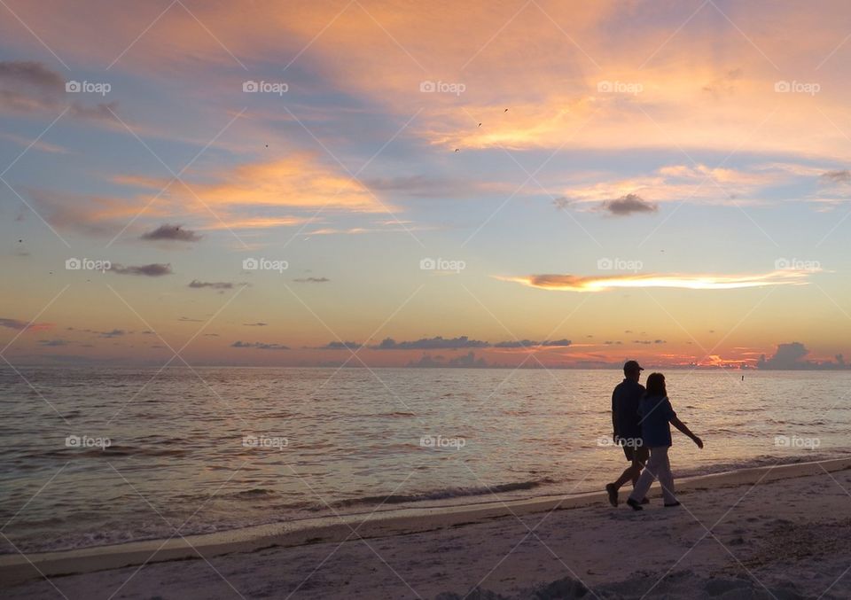 Couple walking on beach