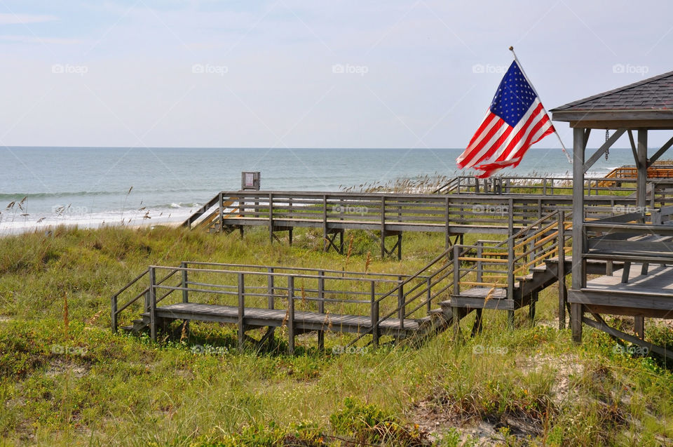 An American Flag hangs proudly at the beach. 