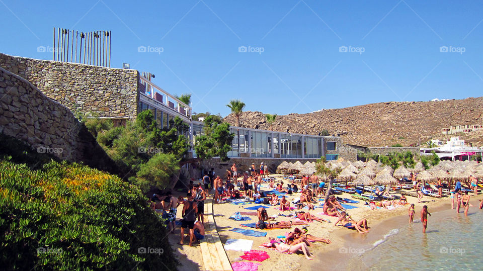 mykonos greece paradise beach. crowded summer beach