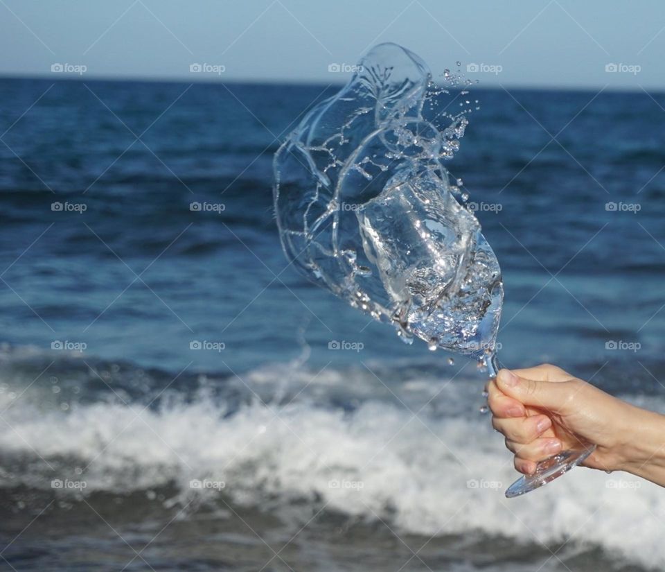 Sea#waves#sky#wineglass#hand#nature