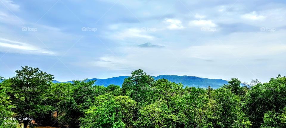 clouds touching mountains