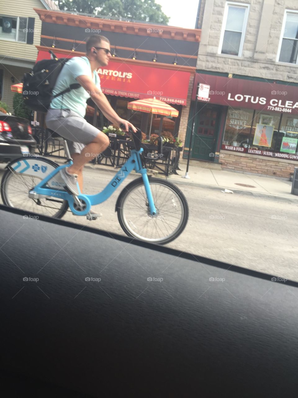 Man on blue bicycle