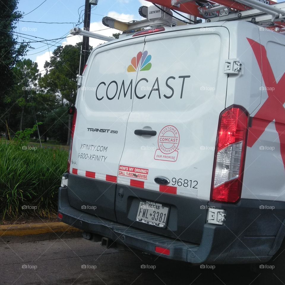 Comcast Xfinity Technician at work driving by heading West in Spring Branch District! The Cable Guy on the Fly!