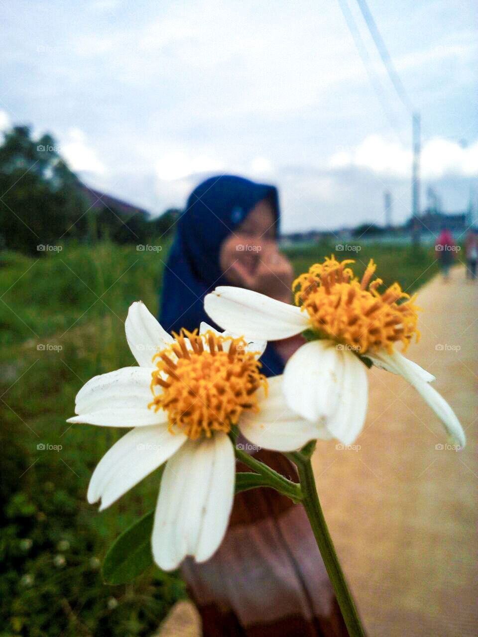 woman behind flower