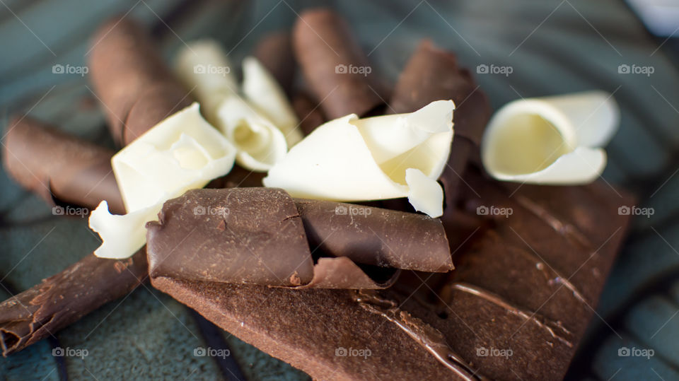 Close-up of white and dark chocolate shaving