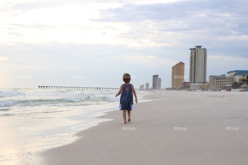 Girl walking on the beach