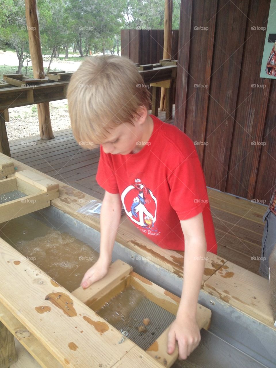 Boy panning for gold