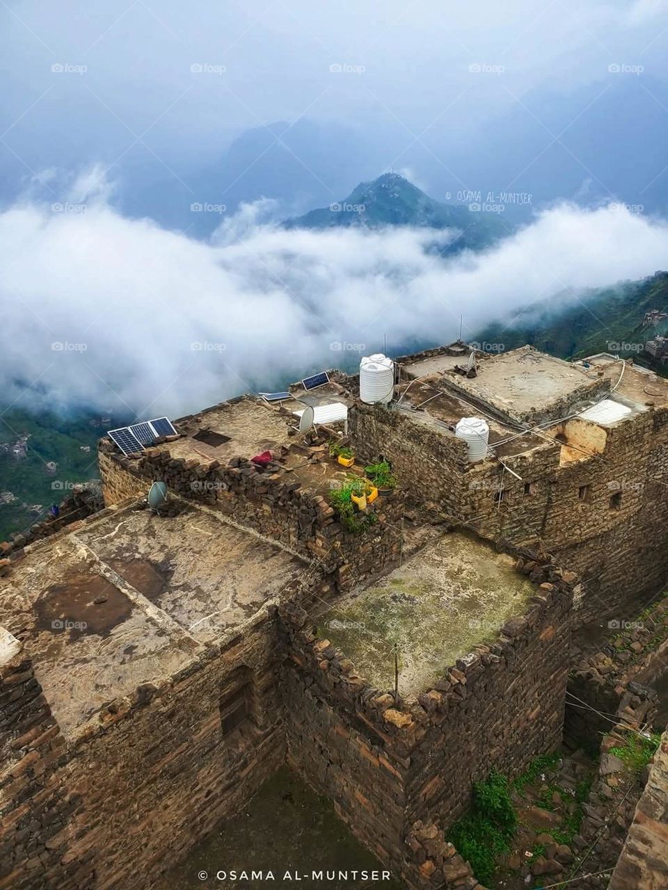 A stunning view of green mountains covered in fog in Yemen