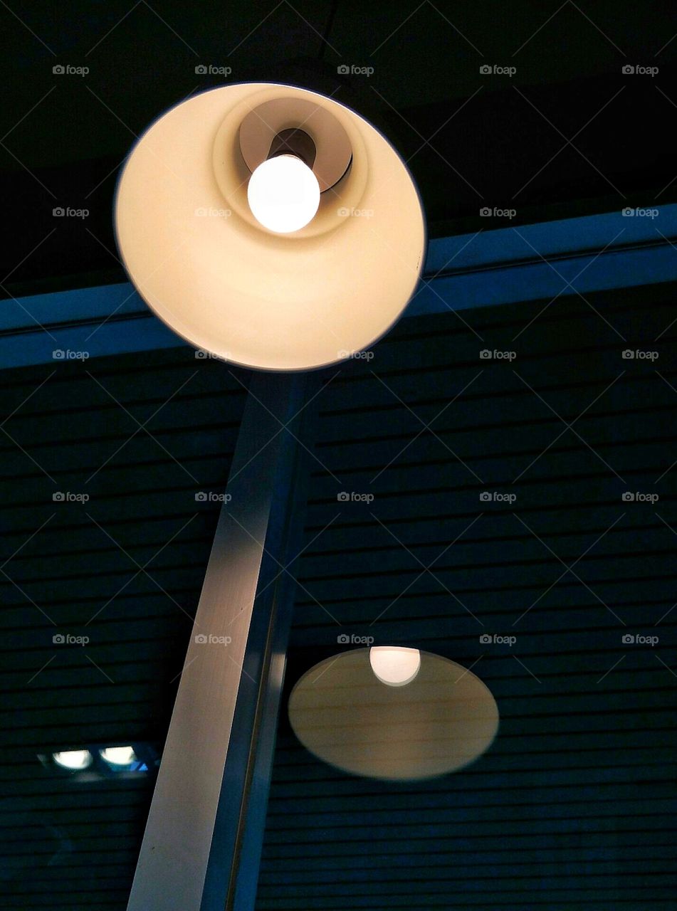 Warm light from the lamp.