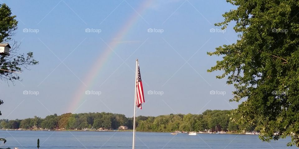 American Flag & Rainbow over Long Lake in Michigan