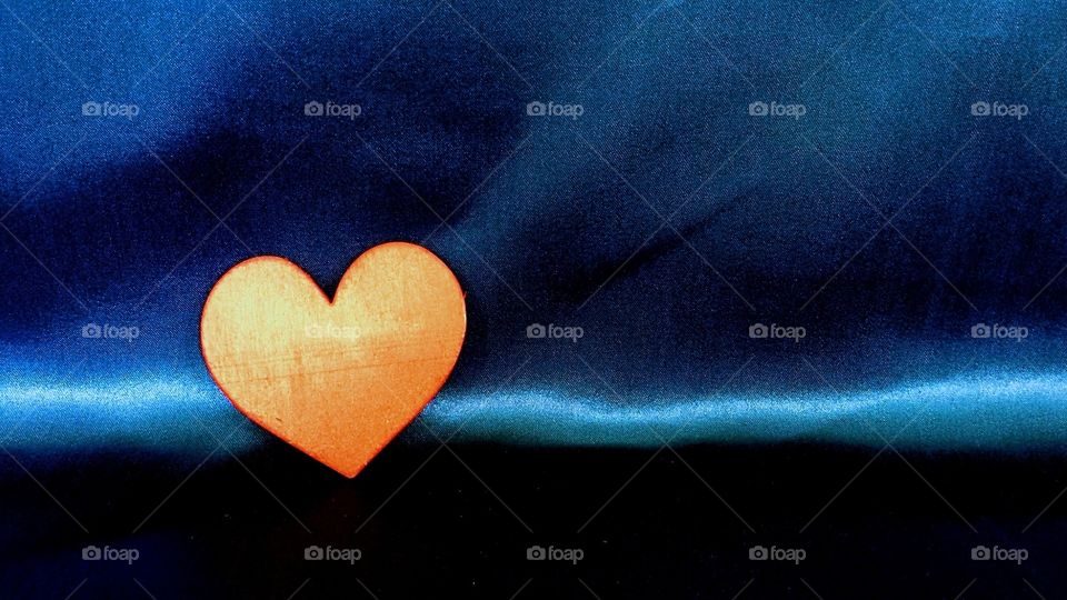 The Orange Heart emoji 🧡 depicts a classic representation of a heart, colored orange