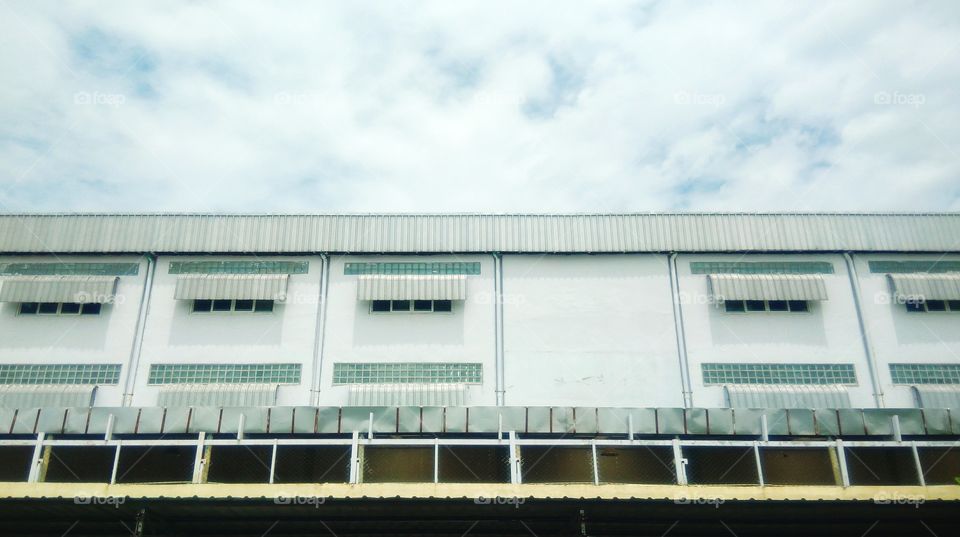 White building with cloud background