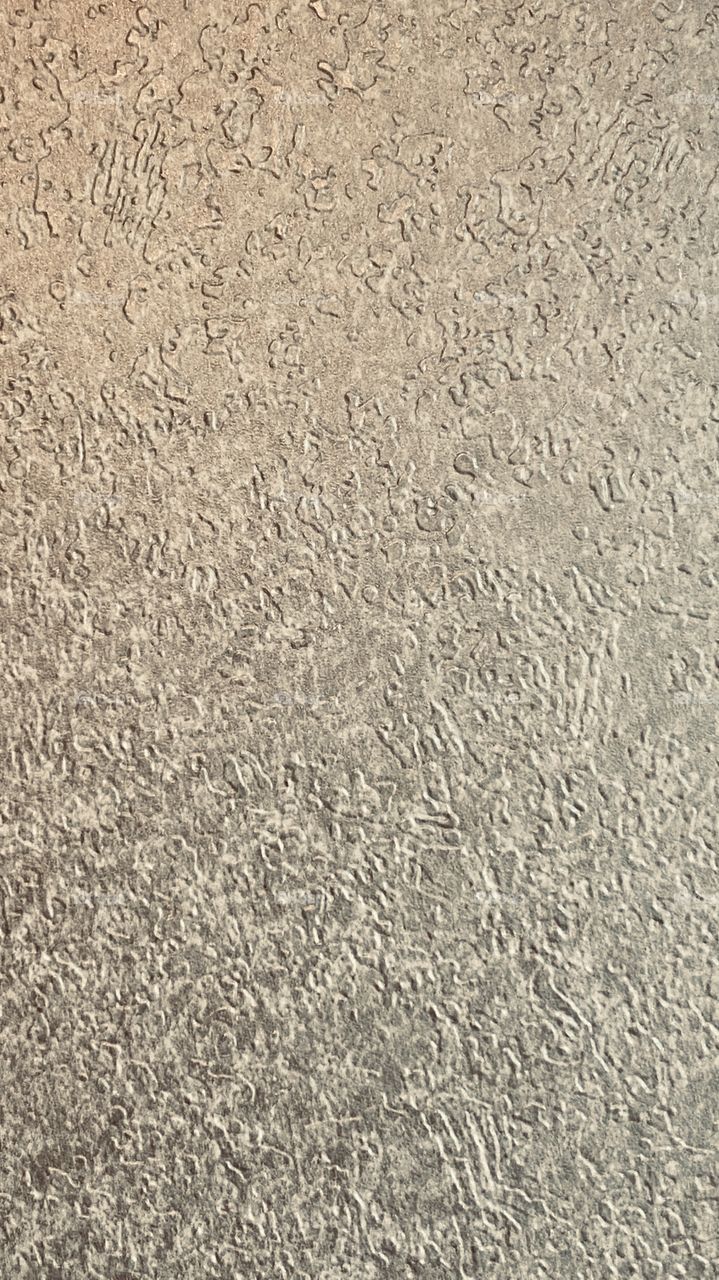 Covering with tiny patches of directional lines, flat lines, angled lines, line up, lines down. 