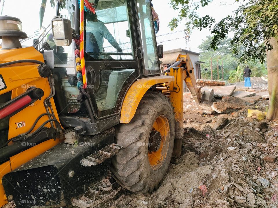 A man working with a JCB machine