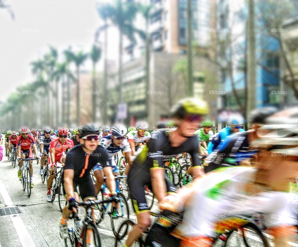 From A to B: cycling race sportsmen reached their destination at full speed, trough the city street.