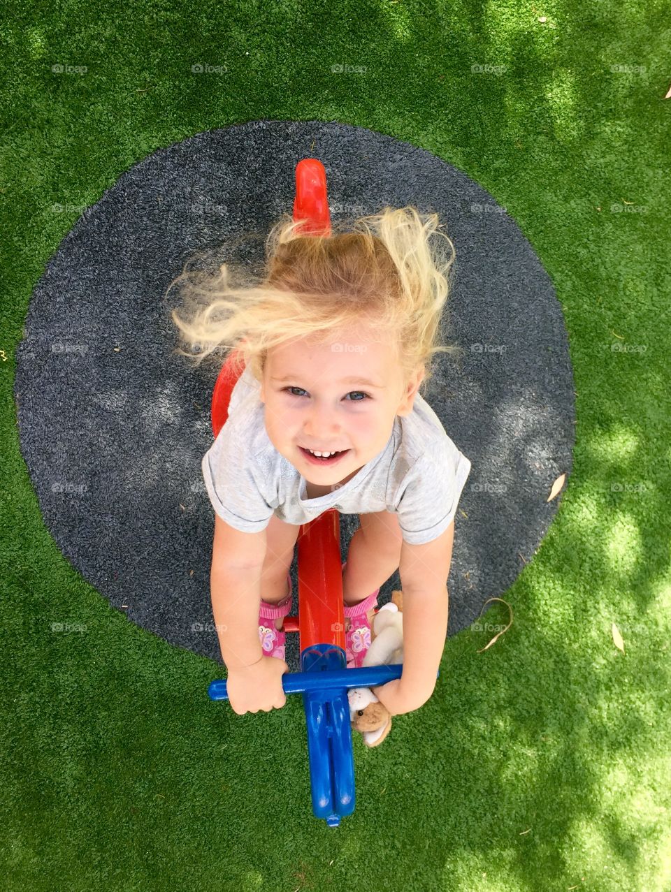 High angle view of girl playing on seesaw