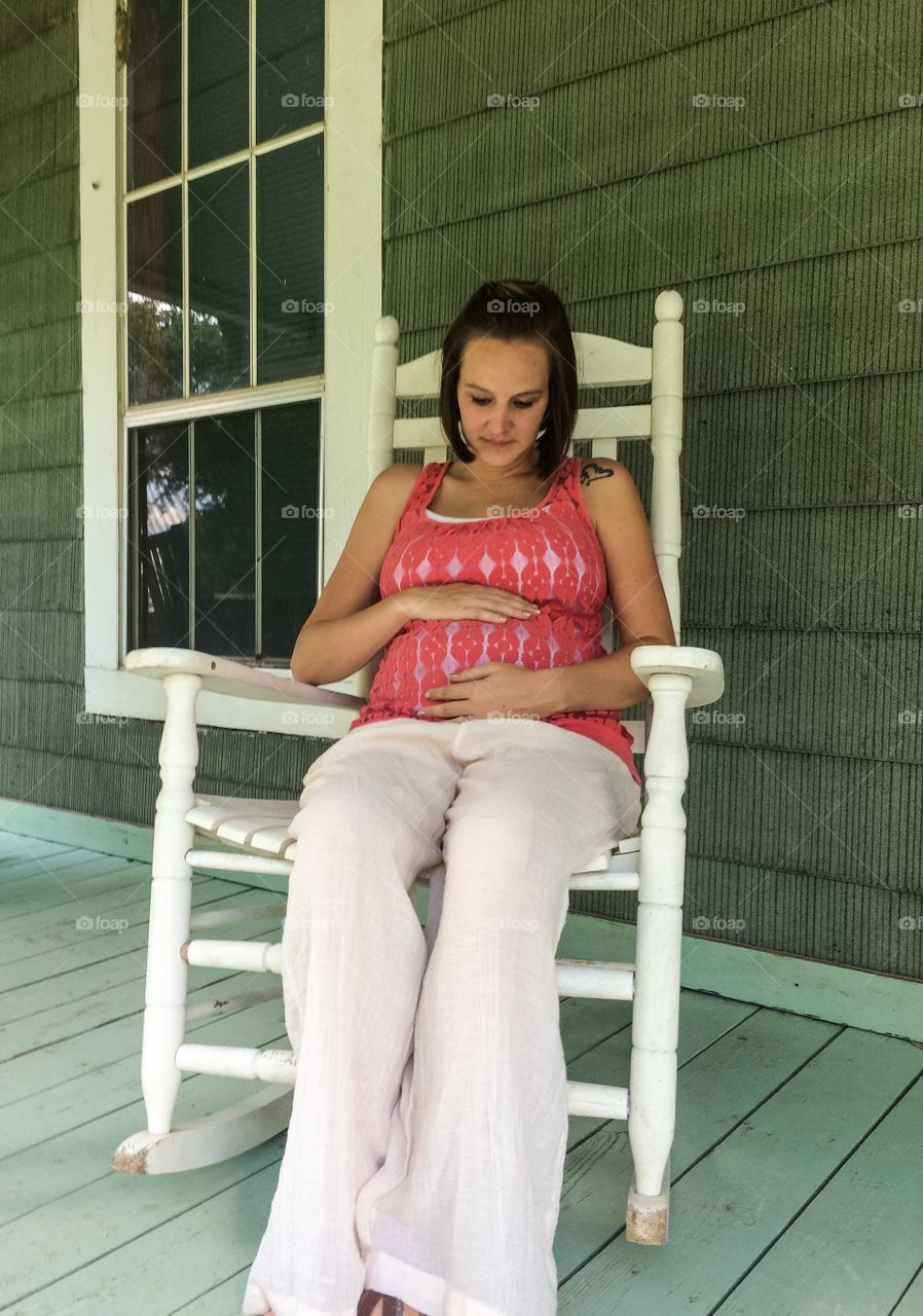 Pregnant woman sitting on chair