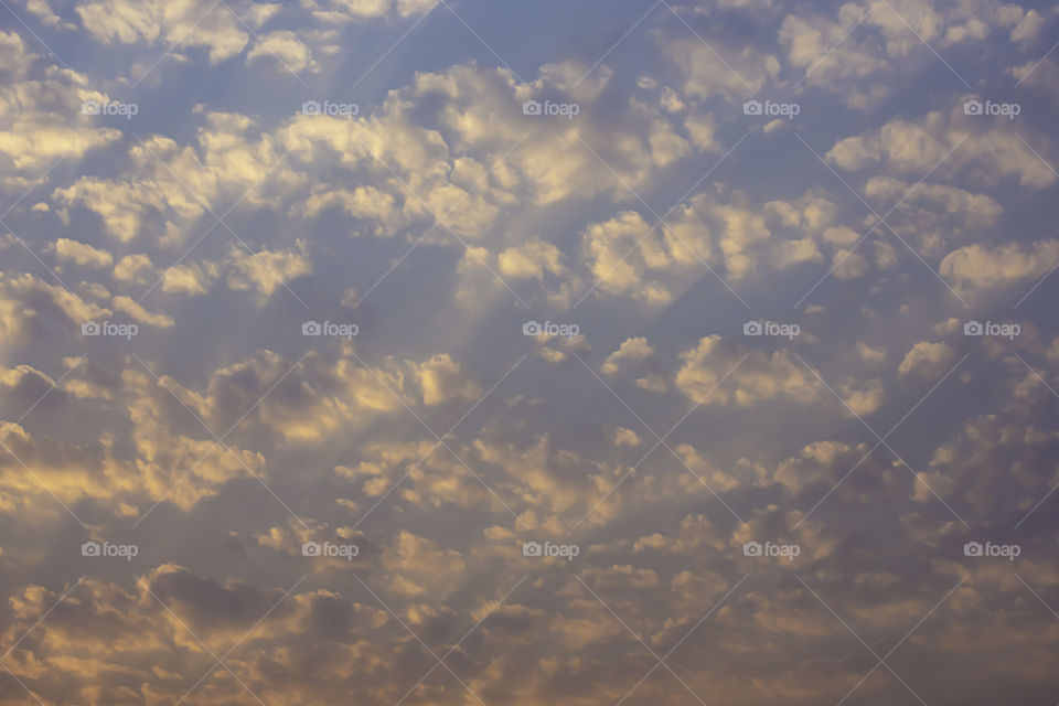 Sky and clouds reflected the morning sun.