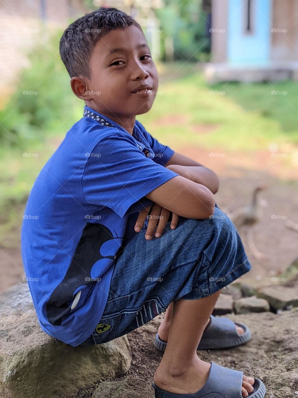 Portrait of a boy in a village, precisely in Southeast Asia.