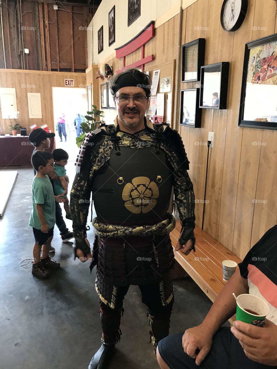 Happy to be clad in samurai armor during a special celebration at the Japanese martial arts dojo.