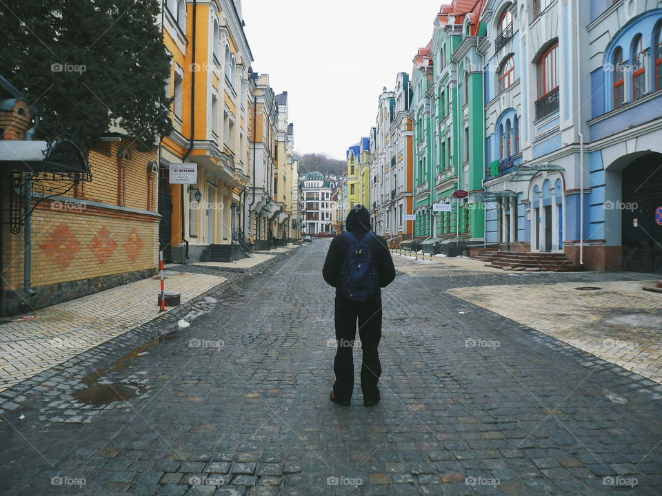 man stands on the empty street in the city of Kiev, Ukraine