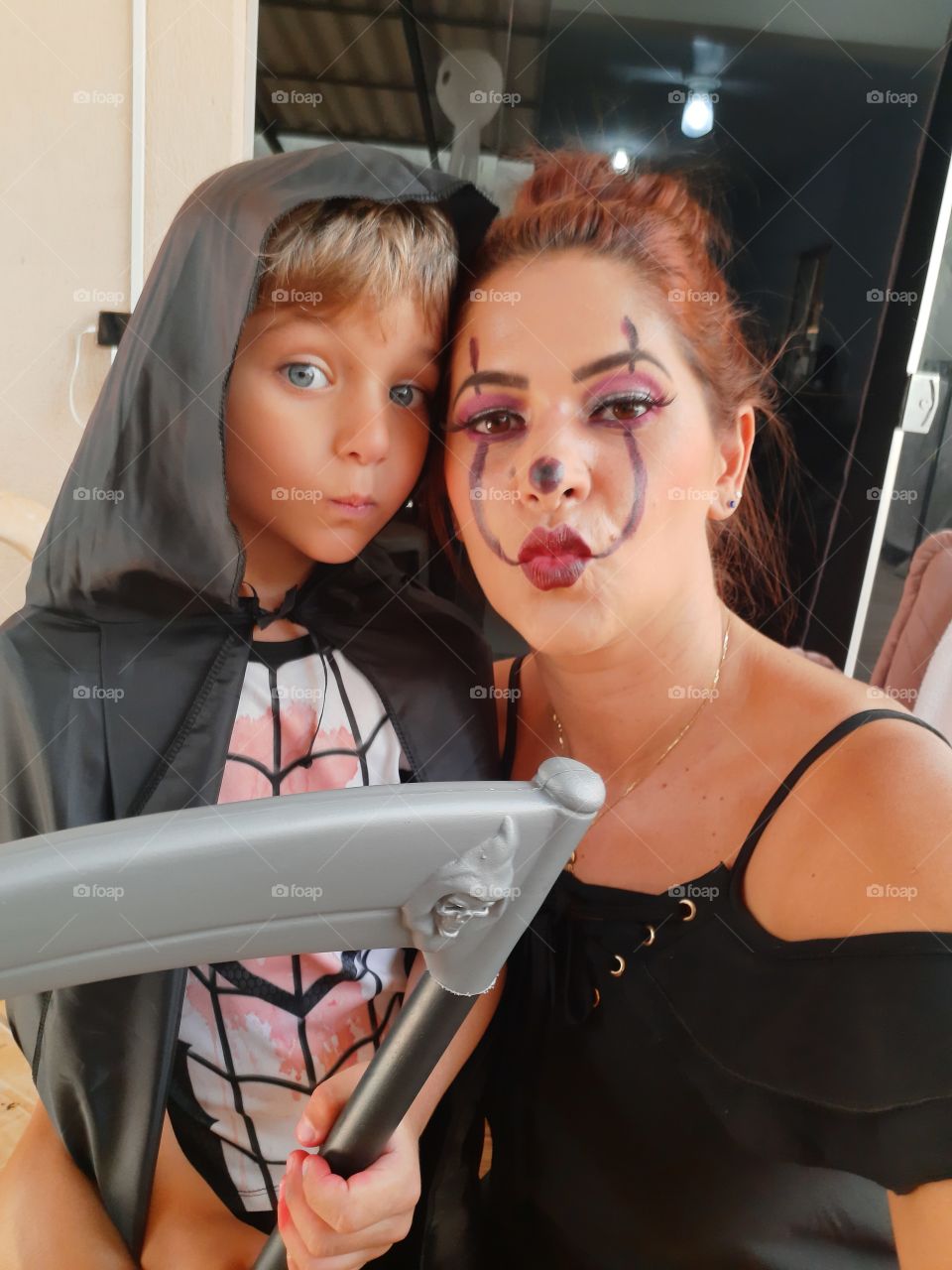 cute boy and mother dressed in halloween theme