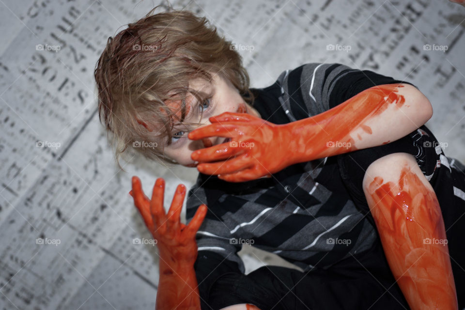 Zombie kid with fake blood (photo series)