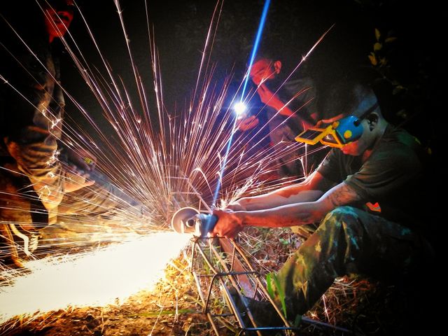 man cutting metal