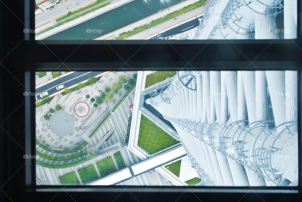 Looking down through glass floor from tower in Japan