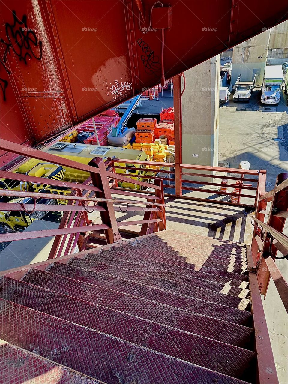 These are the red metal staircase and support structures of the “Pulaski Bridge” at “Newtown Creek” in LIC, Queens and the shadows they cast to combine to interesting interwoven patterns. 2024. Hypnotic Productions