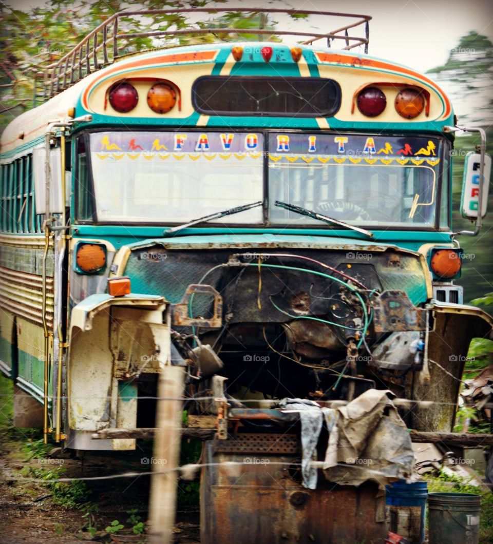 Chicken bus graveyard in Guatemala 