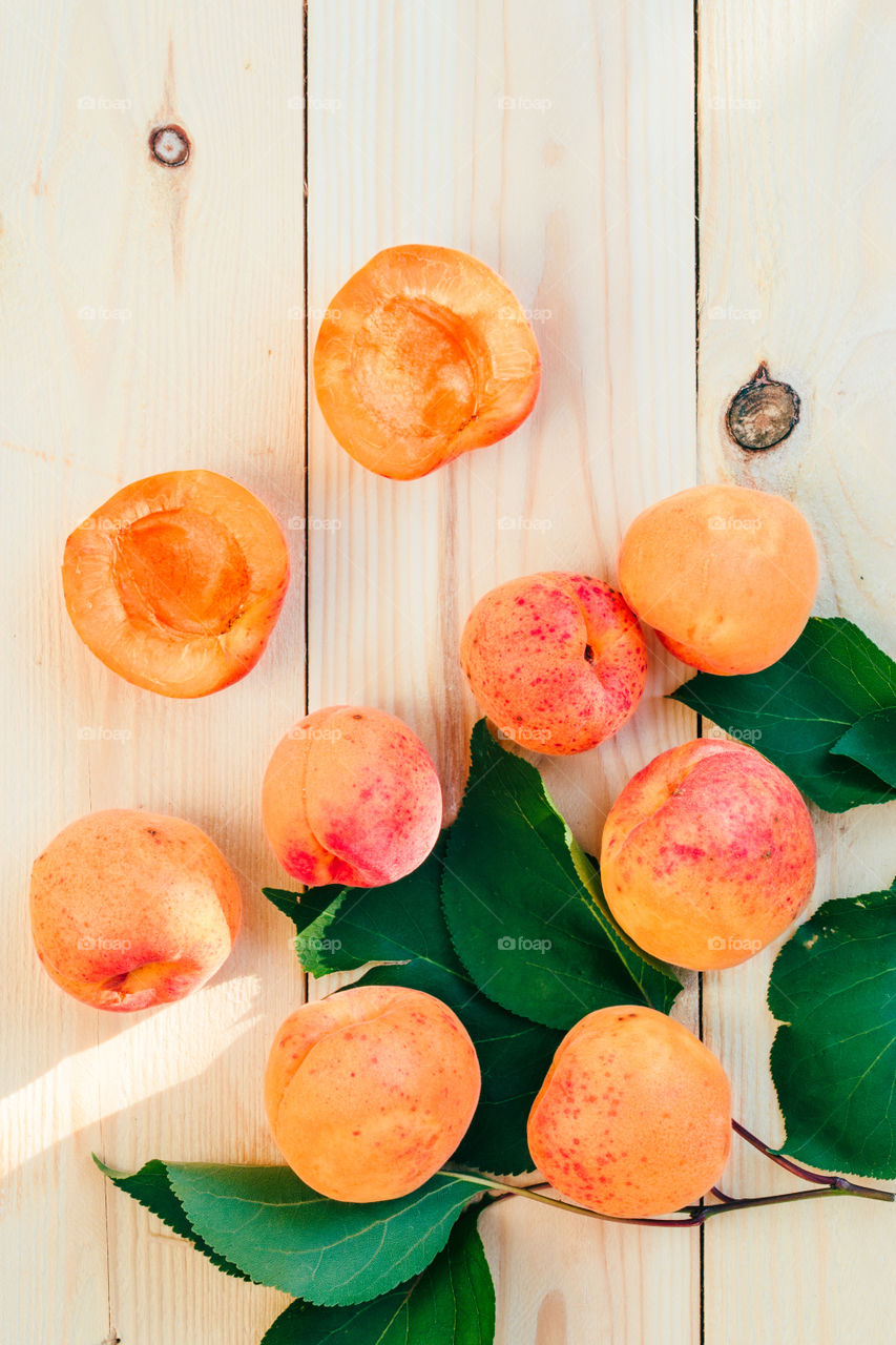 Fresh apricots picked straight from tree in the garden put on wooden table