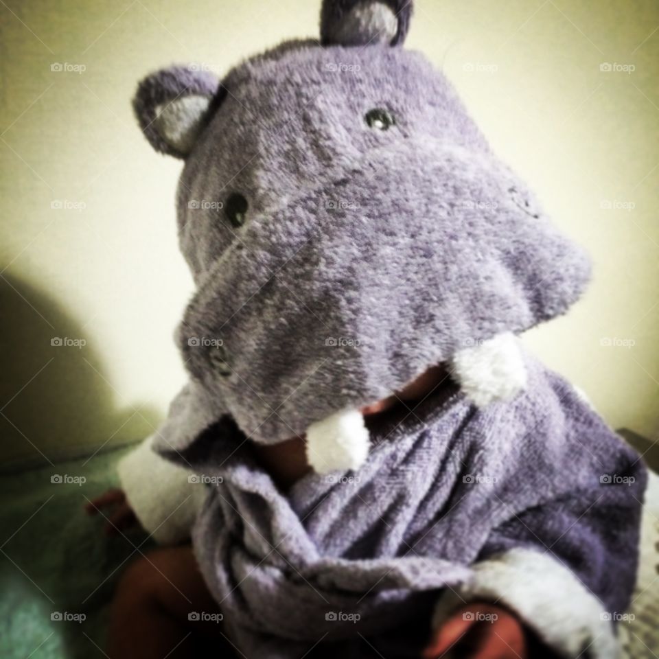Baby in a hippo robe

