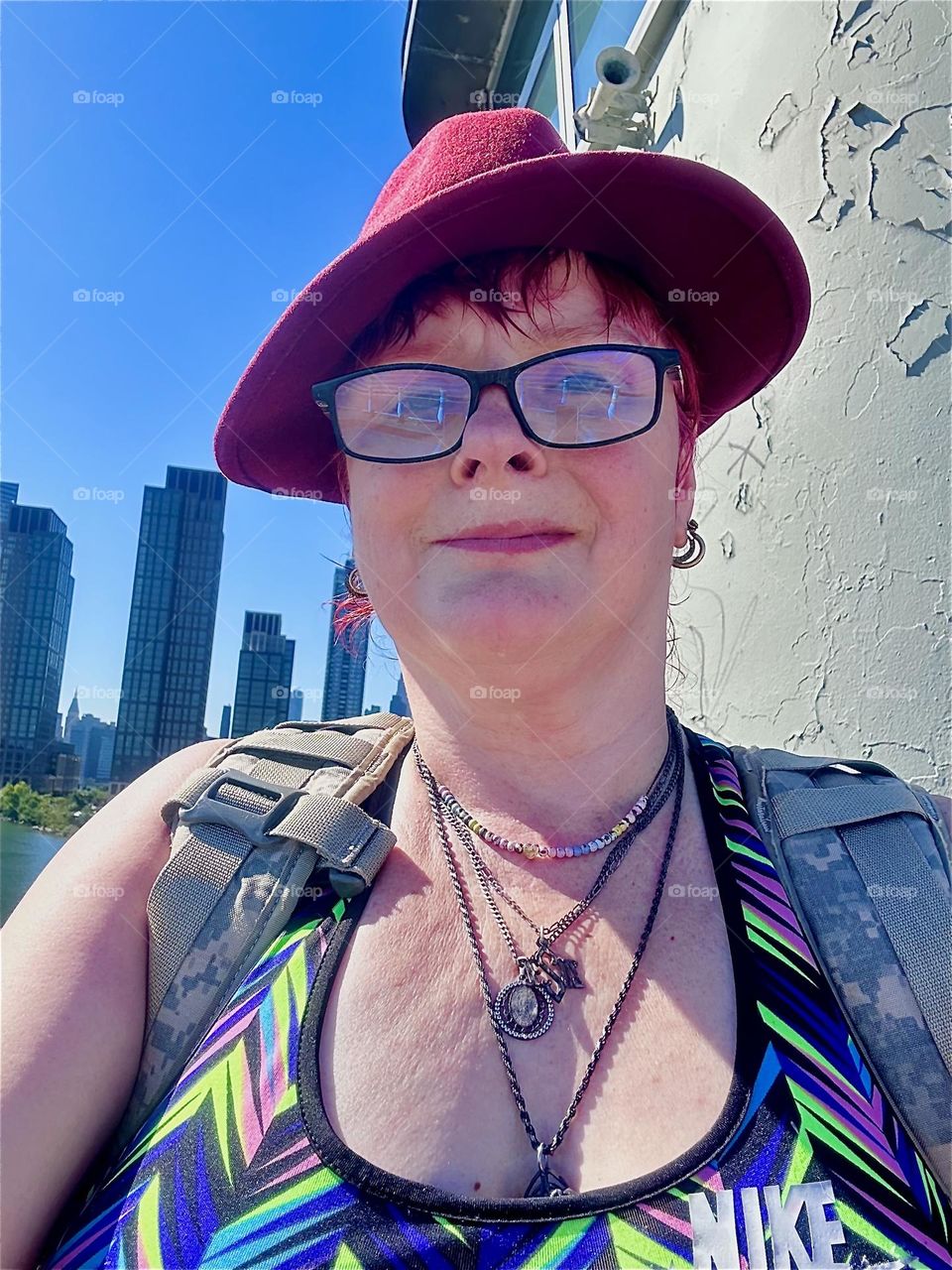 This is me, “Petra Schiller” a.k.a. “Maxine Firefox” standing high up on the “Pulaski Bridge” at “Newtown Creek” that connects “Greenpoint”, Brooklyn to LIC, Queens on one of the last days of Indian summer. 2024. Hypnotic Productions