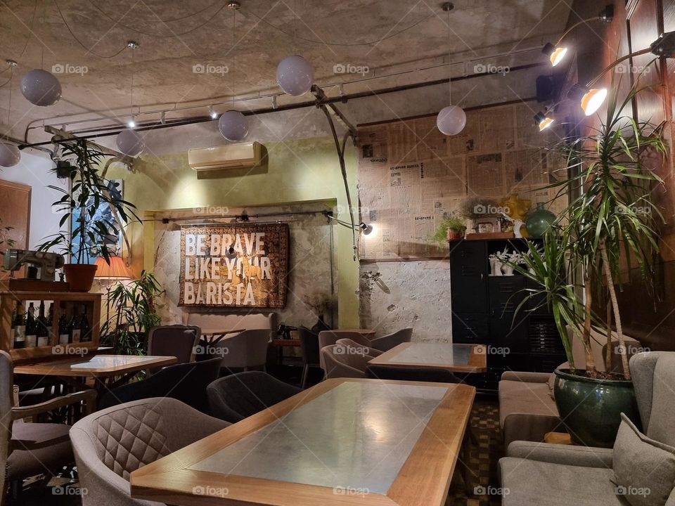 Interior of an amazing coffee shop Atelier in Odesa; "Be brave like your barista"