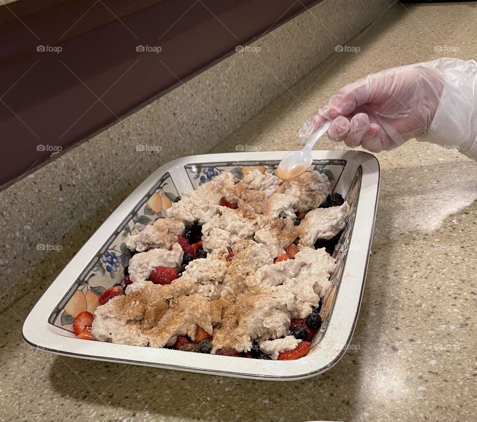 Making a berry cobbler 