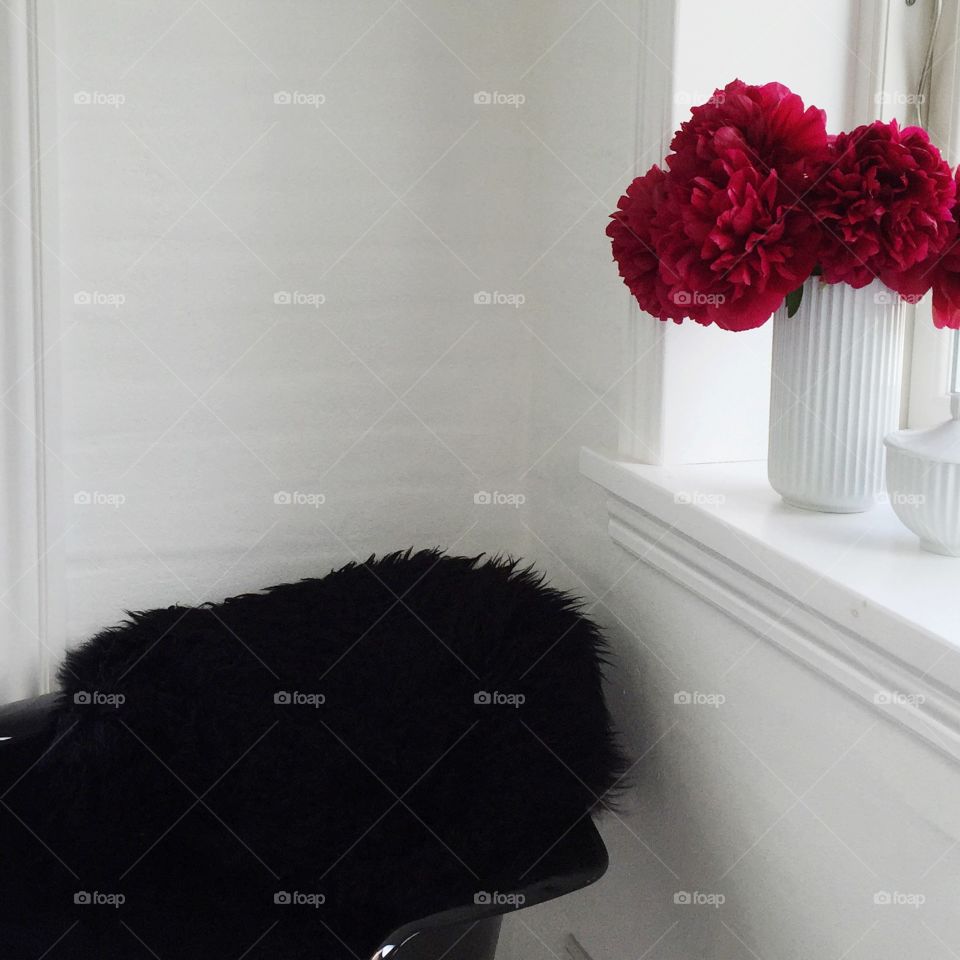 Home decor . A summer home decor with eames chair and Lyngby vase with peonys