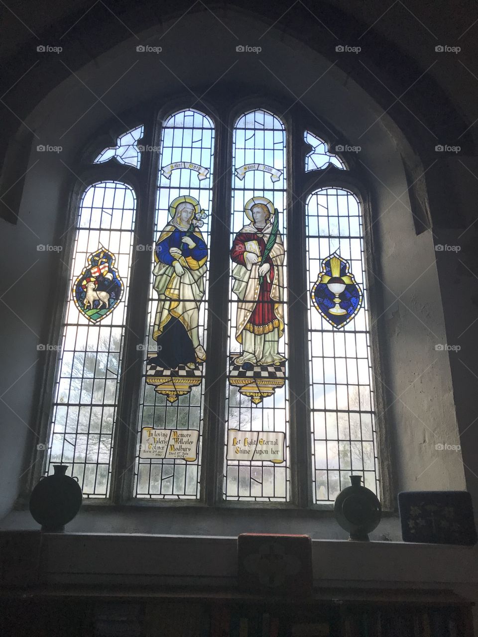 Shining examples of much loved stained glass windows, at St George Church in Modbury, Devon