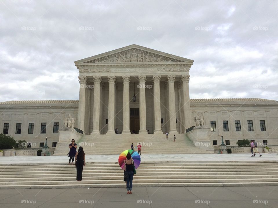 Supreme Court building with LGBT Pride umbrella