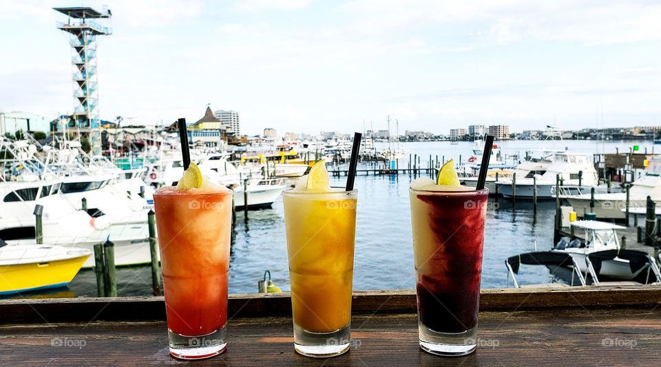 3 colorful drinks on the harbor...