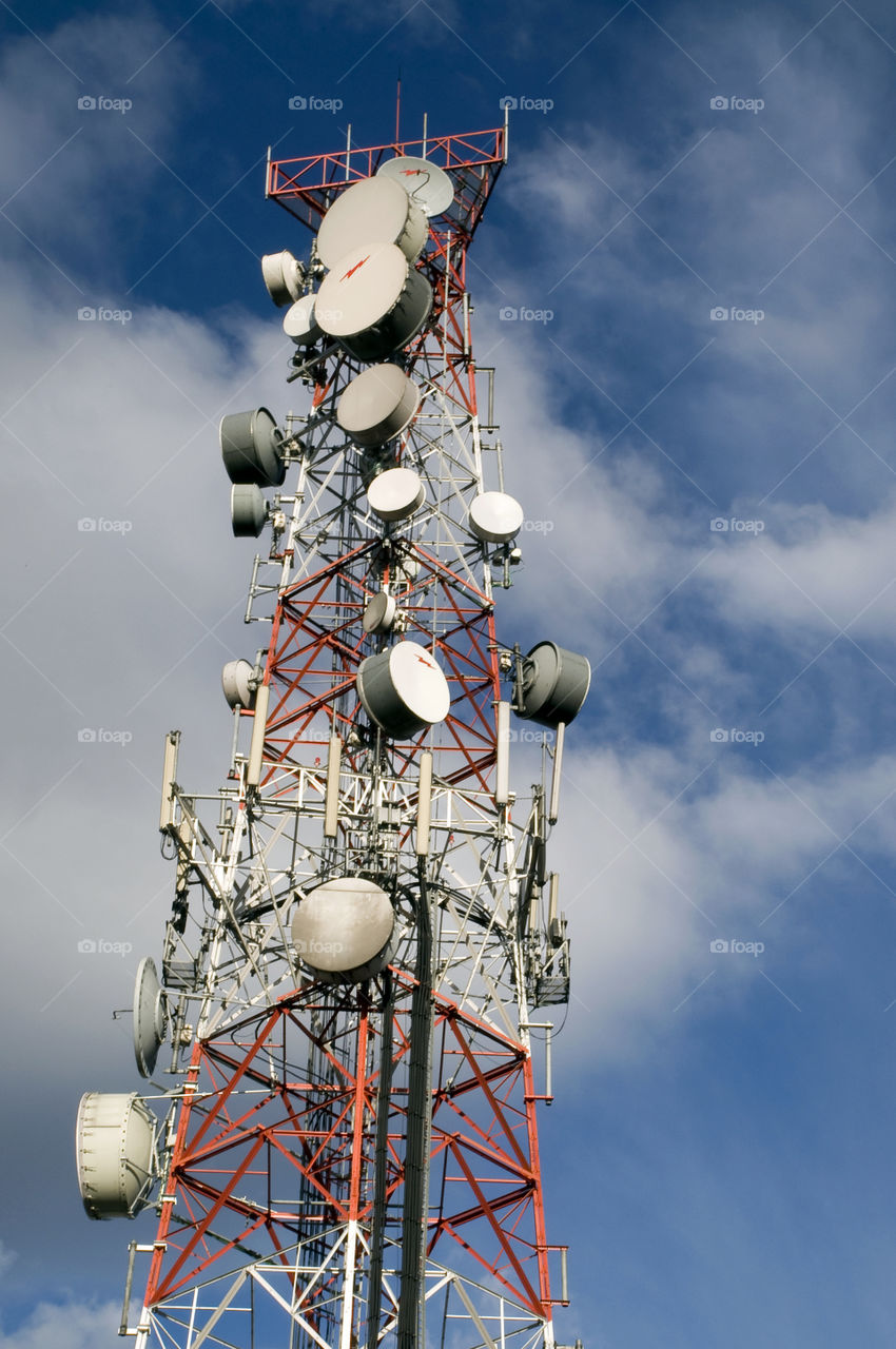 Communications antenna with blue sky background
