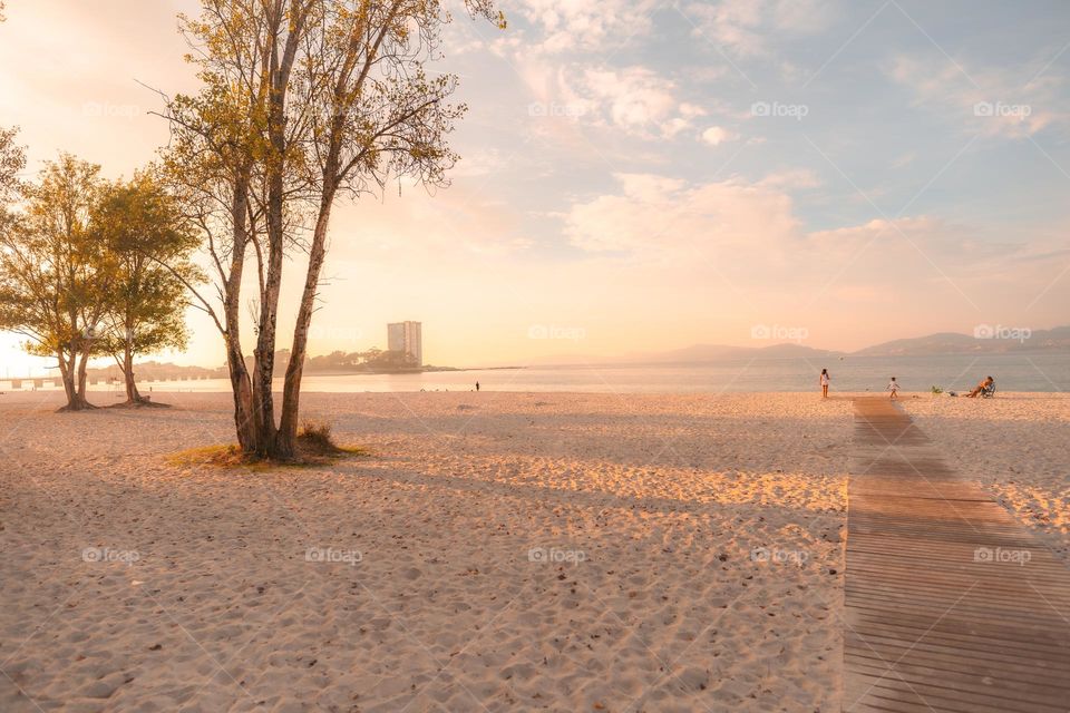 Family spending the afternoon on the beach in Vigo