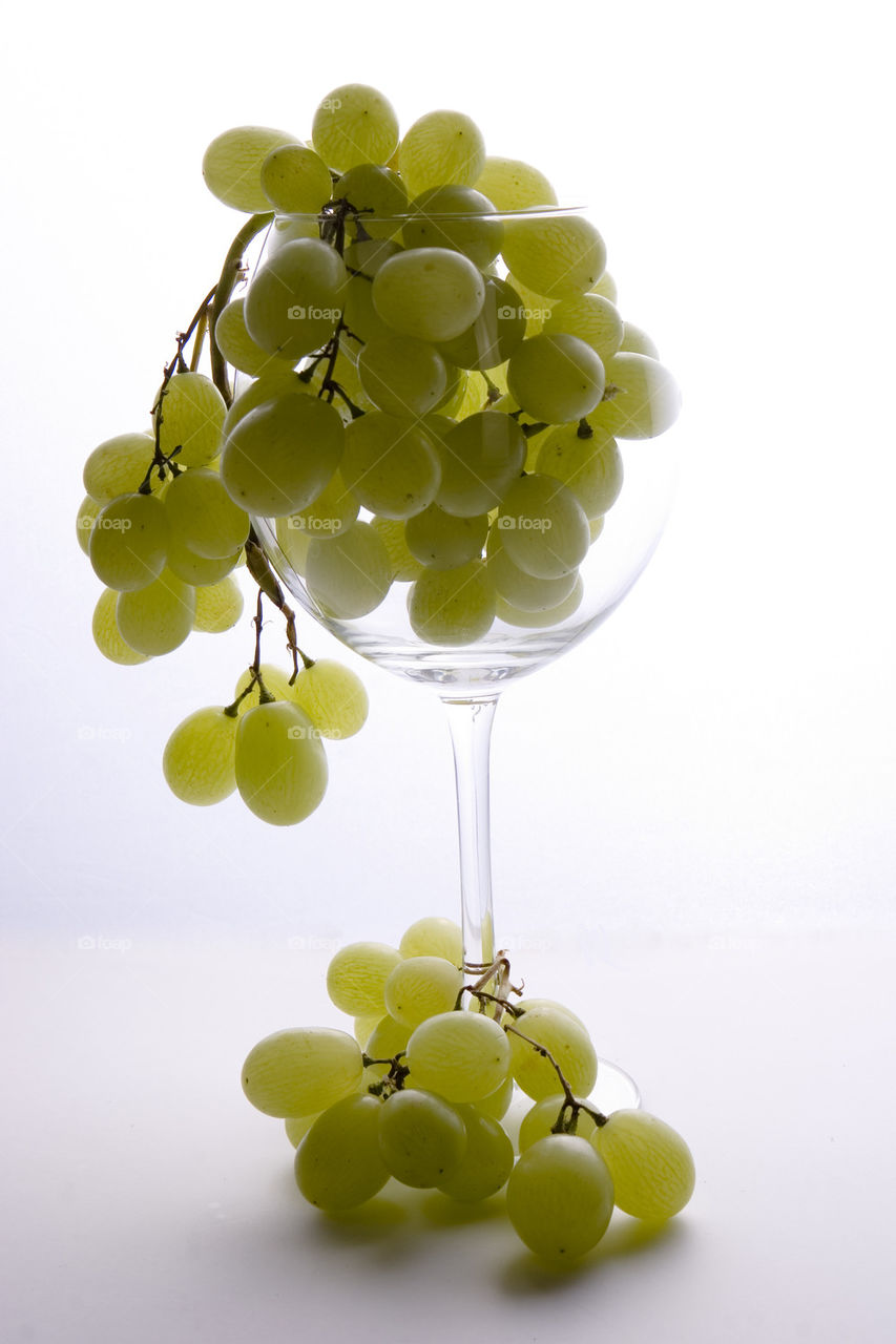 Grapes in wine glass