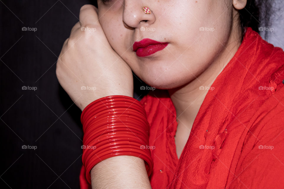 Red lipstick with red dress and red bangles