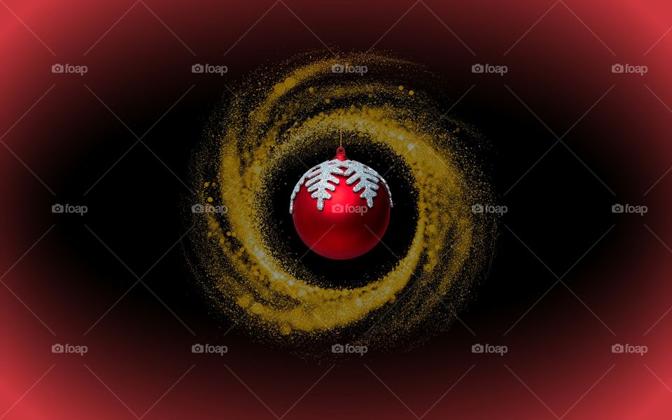 Round golden ring-shaped with hanging
round red globe in mystery backround