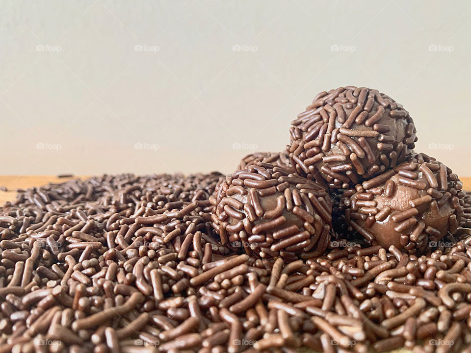 Homemade Brigadeiro:  a Brazilian chocolate truffle garnished with sprinkles.