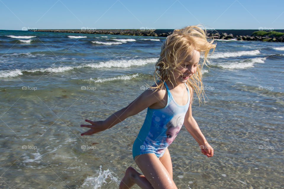 Girl running on beach