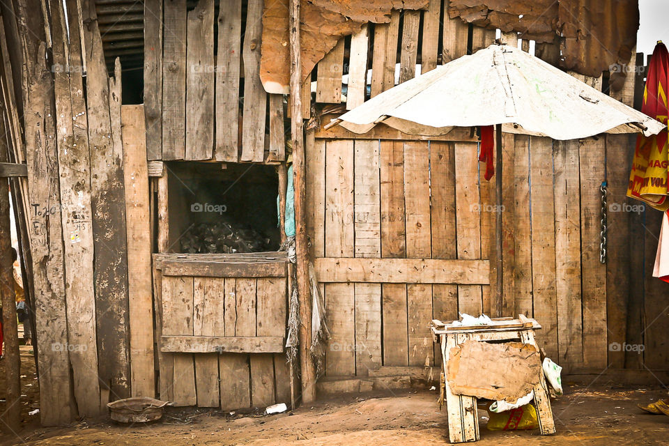 'The coal shop' a local selling coal from the wooden house in Africa. Rectangles everywhere
