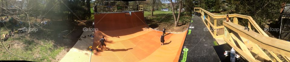 Wooden skateboard halfpipe ramp panoramic shot 