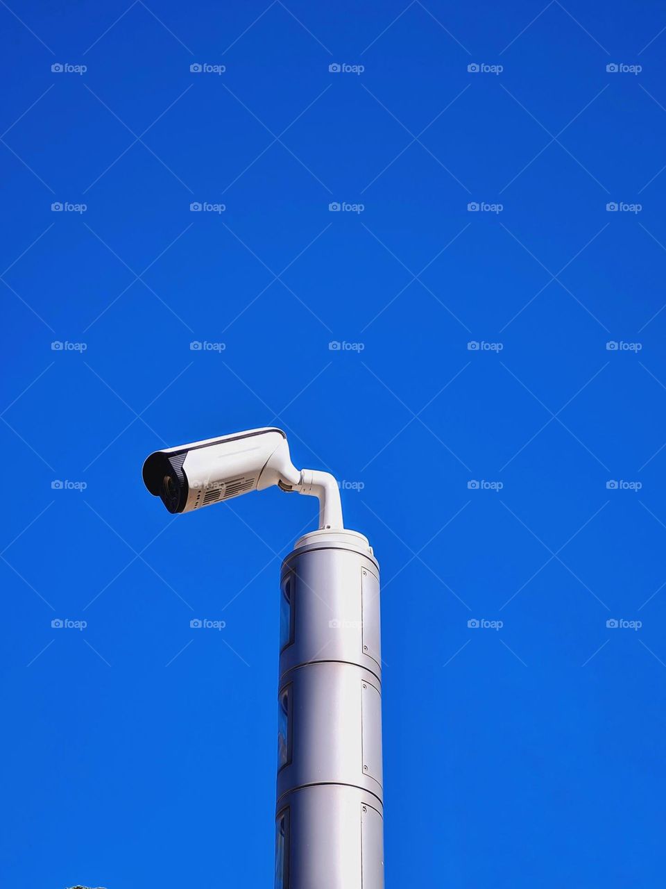 video surveillance camera on metal rod